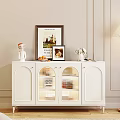 White Modern Sideboard With Glass Doors And Decorative Vase Photo Frames Fruit Figurine