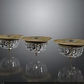 Elegant Three Candlesticks Featuring Golden Bases Transparent Crystal Structures And Colored Top Decorations