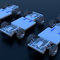Silver Gray Metal Chassis With Wheels And Blue Components On Dark Background