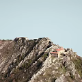 Scenic Mountain Landscape with Rocks Green Vegetation Red Roofed Building and Path Near Waterfront
