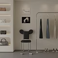 Stylish Clothing Rack Featuring Hanging Clothes Black Chair Shoes And Wall Art