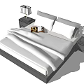 Modern Double Bed with White Bedding Bedside Tables Table Lamps and Open Book