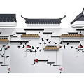 Traditional Chinese Building Exterior Wall with Curved Eaves White Walls and Flying Bird Motifs