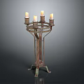 Vintage Metal Candelabra With Four Lit Candles And Ornate Stand Base
