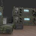 Military Radio Communication Devices With Multiple Green Electronic Appliances Display Screens Control Buttons And Knobs