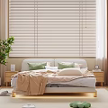 Modern Double Bed with White Headboard Green and White Pillows Beige Blanket and Wooden Floor