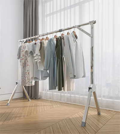 Silver Metal Freestanding Garment Rack With Various Soft Colored Clothes On Wooden Floor 3d model