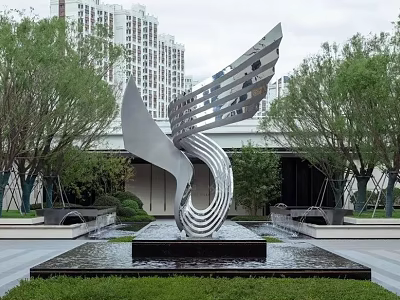 Streamlined Silver Metal Sculpture In Outdoor Space With Water Fountain Trees And High Rise Buildings 3d model