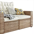 Rattan Outdoor Sofa with White Cushions Geometric Pillows and Throw Blanket