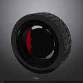 Modern Black Car Tire With Red Inner Accent And Detailed Tread Texture