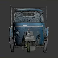 Blue Three Wheeled Cargo Truck With Open Bed And Metal Frame Cab