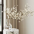 White Blossom Branches In Transparent Vase On Marble Table By Window With Snowy View