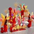 Colorful Floral Decorations With Red Balls And Feathery Plants For Festive Setup
