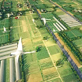 Aerial Planning View of Organized Farmland Greenhouses Roads and Green Space Layout