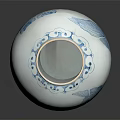 Traditional Blue and White Ceramic Vessel with Floral Bird Motifs and Reflection on Dark Background
