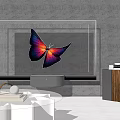 Modern Television Displaying Vibrant Butterfly with Purple Pink Wings on Black Base and Wooden Cabinet
