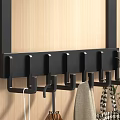 Black Wall Mounted Coat Hooks With Multiple Hangers For Clothes And Bags On Wooden Wall