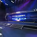 Event Entrance Stage Design with Blue Purple Lighting Theme Text and Company Logo