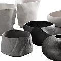 Modern Decorative Ceramic Vessels in Black and White with Various Shapes and Textured Surfaces