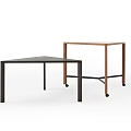 Modern Office Desks With Triangular Black And Rectangular Brown Designs And Wheels
