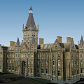 Historic Gothic Style Building With Stone Exterior Pointed Towers And Arched Windows