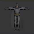 Man in Batman Costume Posing with Arms Outstretched Against Gray Background
