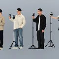 Group of People Using Microphones and Holding Phones for Live Streaming Session