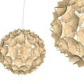 Modern Geometric Chandeliers With Hexagonal Patterns And Golden Accents On Dark Wall