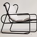 Stylish Modern Leisure Chair With Curved Black Metal Frame And White Padded Seat Backrest