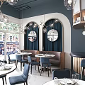 Modern Restaurant Interior With Circular Mirrors Pendant Lights Booth Seating And Round Dining Tables