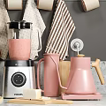 Organized Kitchen Utensils Display With Mugs Plates Bowls Blender Kettle Cutting Boards And Towels