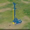 Heavy Duty Industrial Drill Rig With Blue Crawler Base And Yellow Mast On Green Site