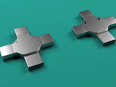 Two Silver Cross Shaped Metal Objects Placed On Green Background 3d model