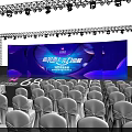 Stunning Stage Design With Blue Lighting Arranged Seats And Backdrop Screens