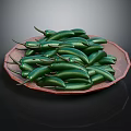 Fresh Green Chili Peppers Arranged on Brown Plate Against Dark Background