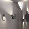 Contemporary Wall Sconces With Diverse Designs Installed On White Interior Walls 3d model
