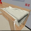 White Clothing Garment With Sheer Lace Fabric Placed On Wooden Table Surface