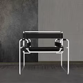 Modern Leisure Chair With White Metal Frame Black Cushion And Armrest In Minimalist Interior