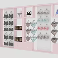 Pink Fashion Background Wall Featuring Hanging Bras And Underwear In Various Styles