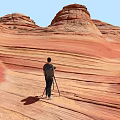Red Rock Landscape With Wave Like Patterns And Standing Person Under Blue Sky 3d model
