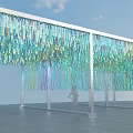 Event Entrance with Colorful Blue Green Hanging Decorations and White Pillars Under Blue Sky