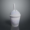 White Smoothie Cup With Colorful Speckles And Straw On Dark Shiny Surface