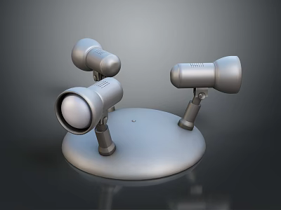Three Silver Metal Spotlights With Adjustable Stands On Round Base 3d model