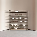 Minimalist Wire Storage Shelf With Multiple Tiers Holding Bowls Plates And Woven Baskets