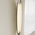 Modern Minimalist Wall Lamp With Round White Shade And Soft Lighting On Beige Wall