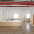 Bright Dining Room Interior With Long Tables Green Chairs Orange Pillars Wooden Flooring And Posters