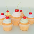 Colorful Cupcakes With Swirled Frosting Paper Liners And Fresh Cherries On Top