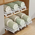 Decorative Plate Set with Green Beige Patterned Edges on White Racks in Wooden Cabinet