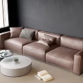 Brown Leather Sofa with Cushions and Round White Coffee Table Set by Window on Rug