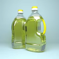 Two Bottles of Clear Edible Cooking Oil with Yellow Caps and Red Labels